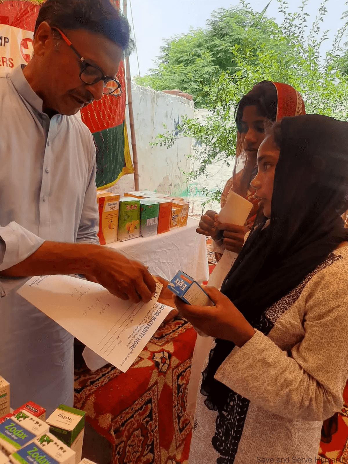 Health outreach activity at the brick-kiln medical camp.